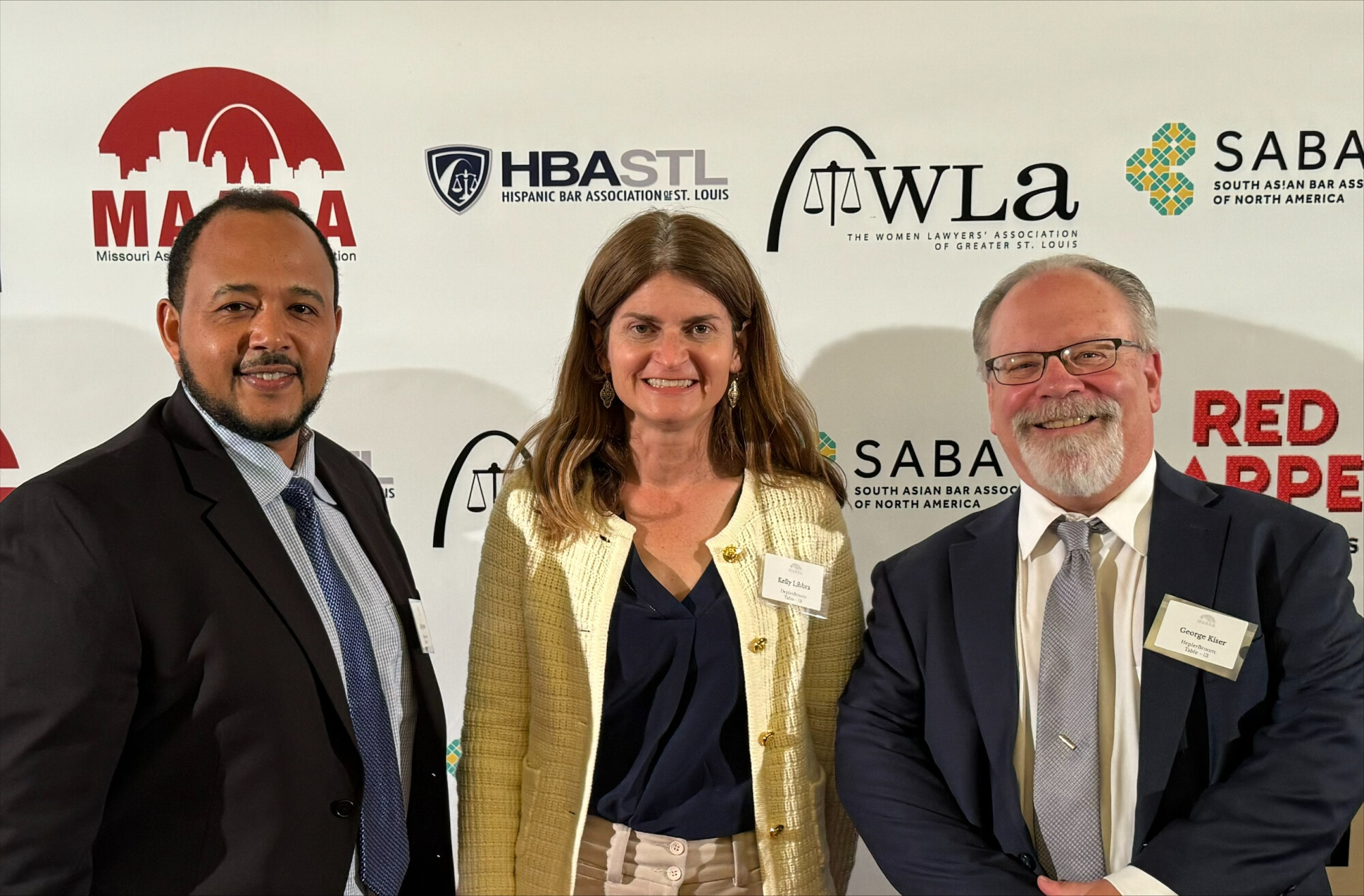 HeplerBroom attorney Alemayehu Ayanaw, Kelly Libbra, and George Kiser